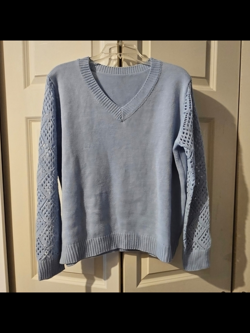 Light Blue V-Neck Sweater with Open-Knit Sleeves
